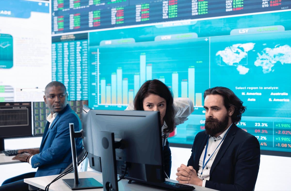 Analysts reviewing market data on a trading floor